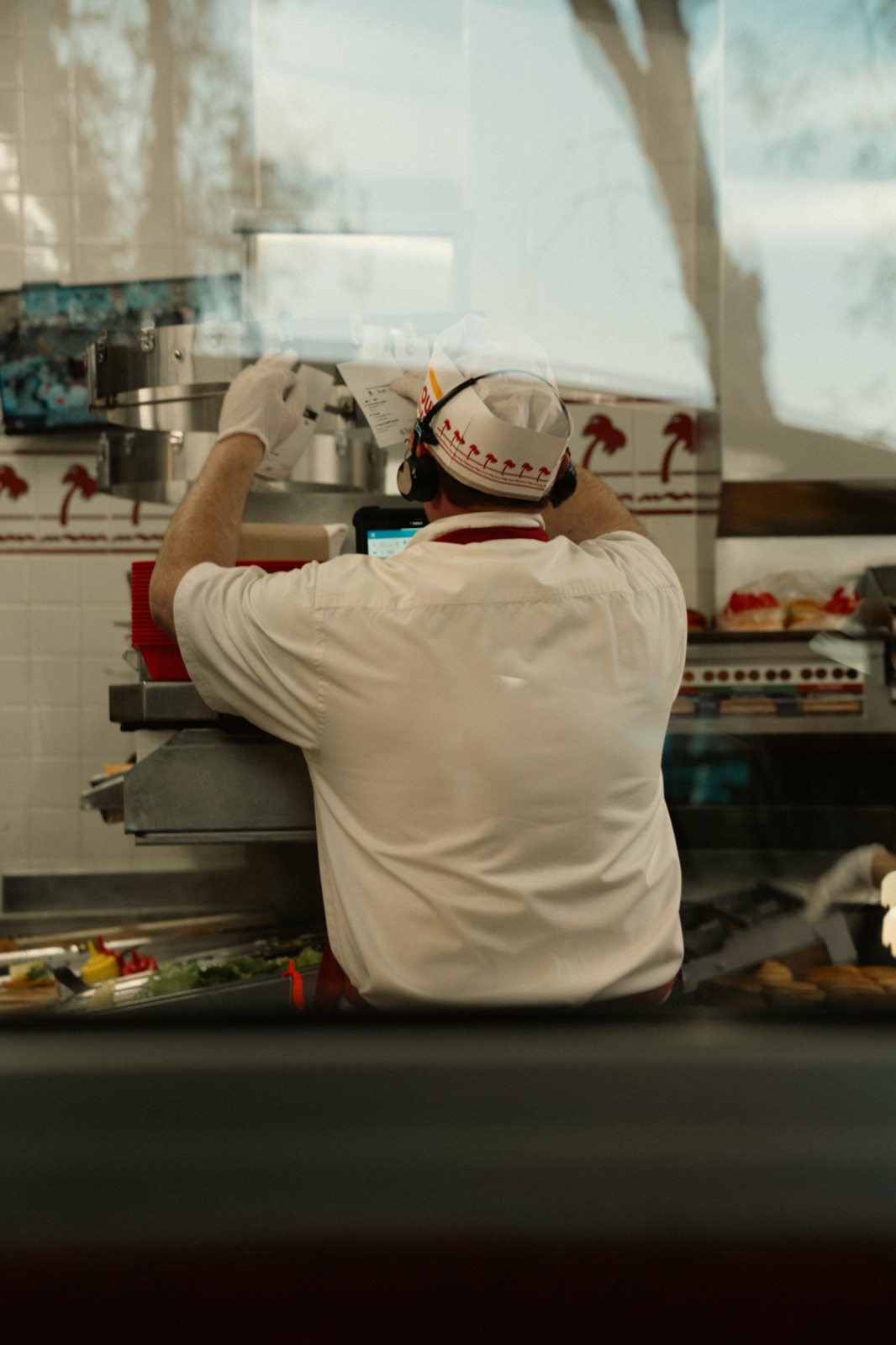 QSR crew member working the line during a shift